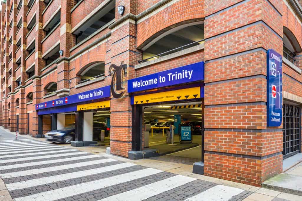 Welcome signs and external branding at the entrance to the Trinity Leeds car park