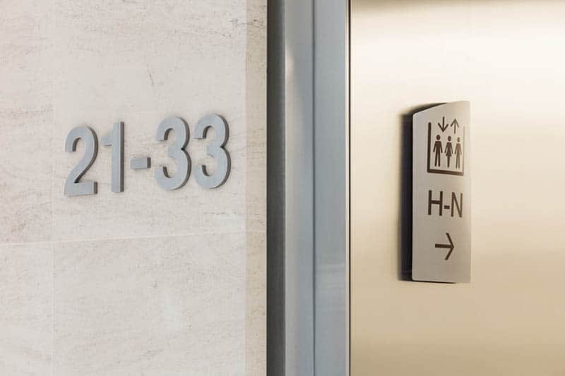 Front of house wayfinding signs in 20 Fenchurch St